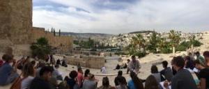 Students, teachers, and alumni learn during their field study to Israel.